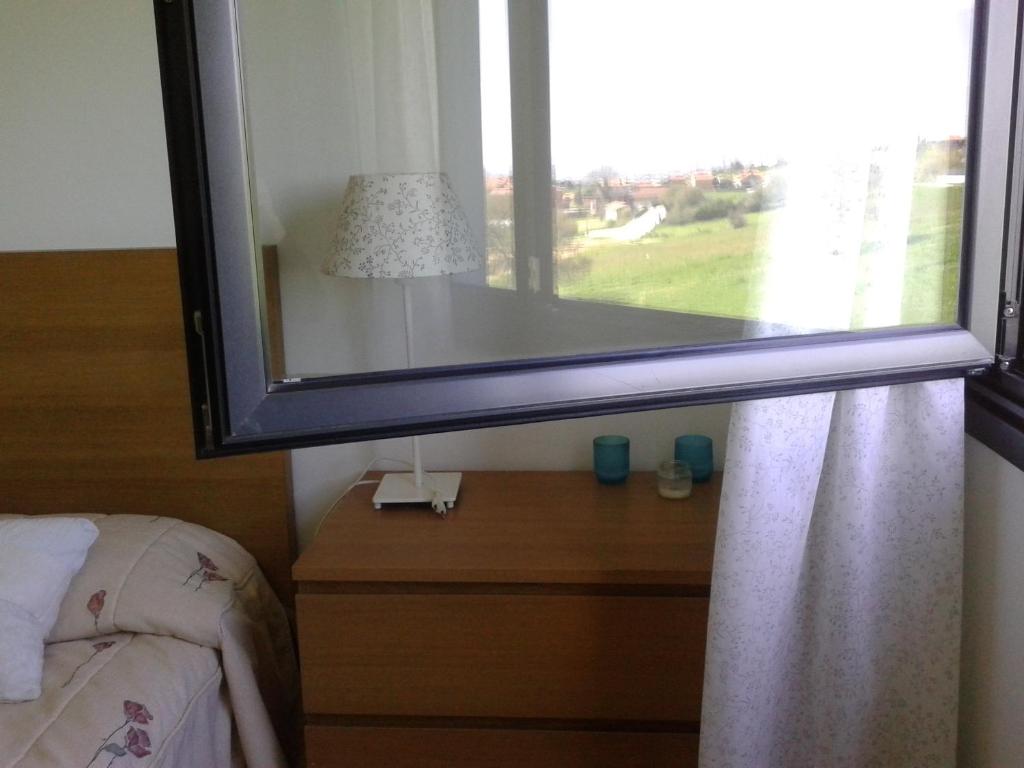 Postel nebo postele na pokoji v ubytování TORRE de la FUENTE AprtoVistas Piscina Parking