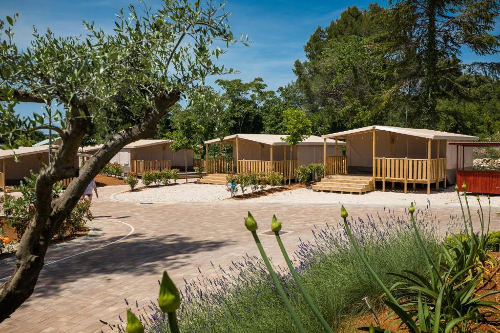 a group of camp huts in a park at Mobile Homes Camping Santa Marina, Lanterna in Poreč