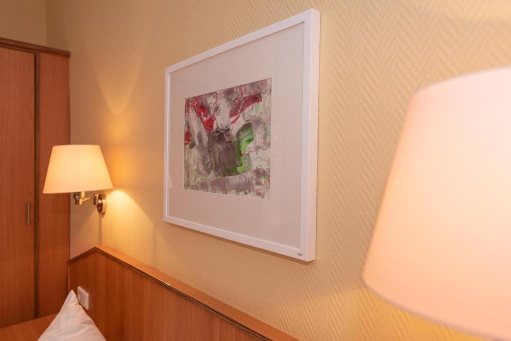 Postel nebo postele na pokoji v ubytování Hotel Europa