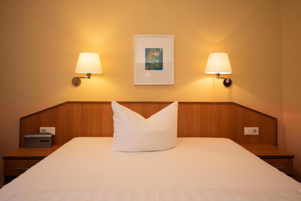 Postel nebo postele na pokoji v ubytování Hotel Europa