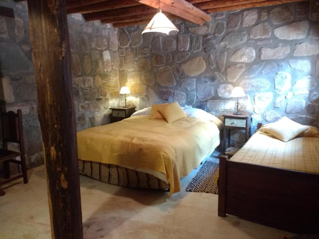 Ένα ή περισσότερα κρεβάτια σε δωμάτιο στο Hostal de Altura