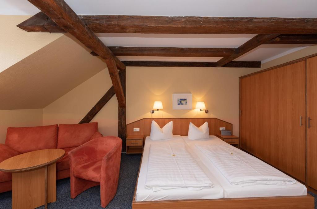 A bed or beds in a room at Hotel Europa