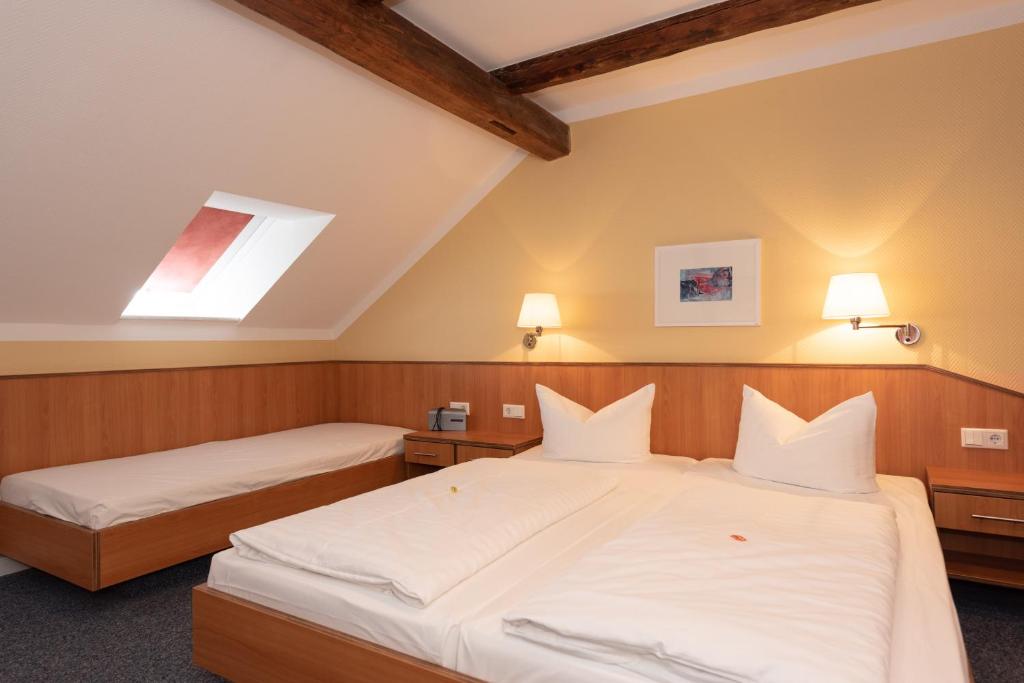 Postel nebo postele na pokoji v ubytování Hotel Europa