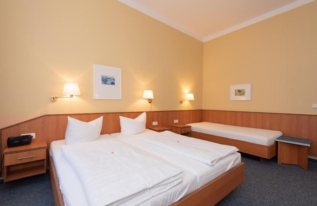 Postel nebo postele na pokoji v ubytování Hotel Europa