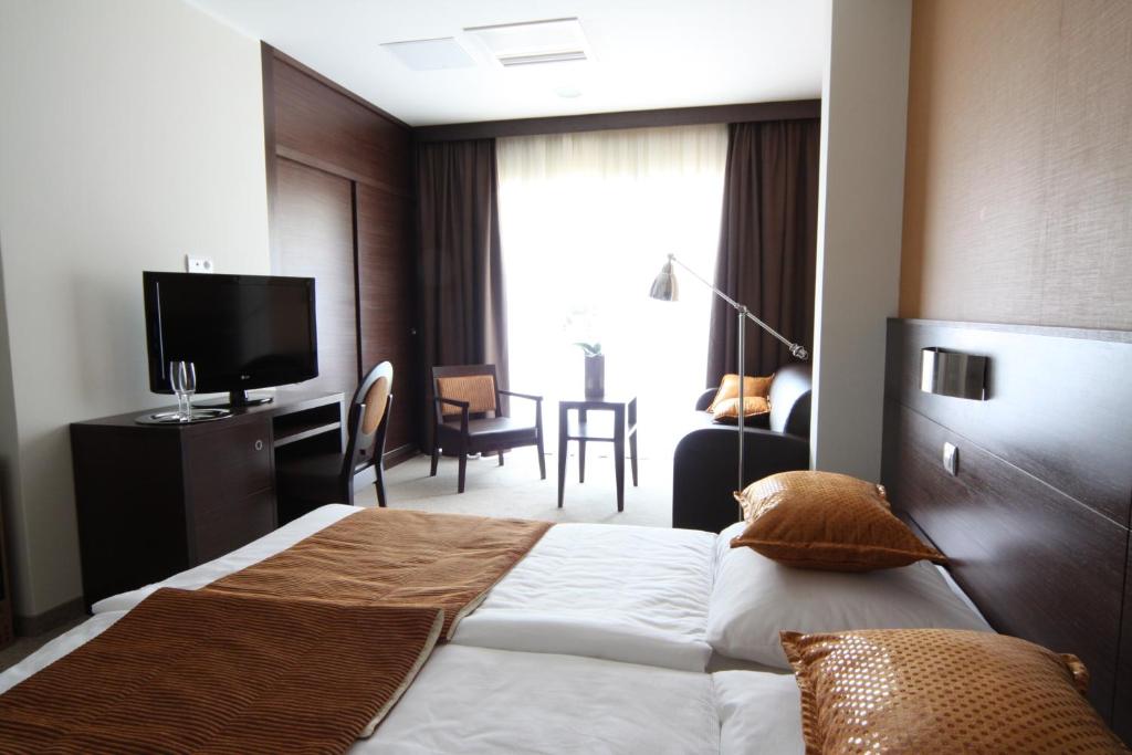 Postel nebo postele na pokoji v ubytování Hotel Mangart