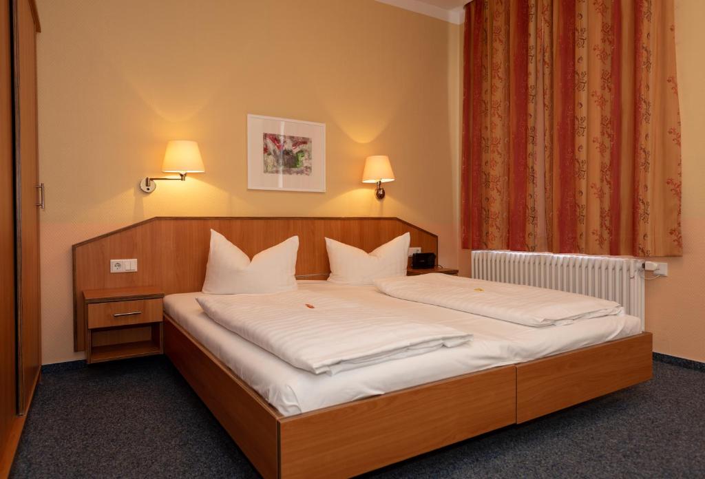 Postel nebo postele na pokoji v ubytování Hotel Europa