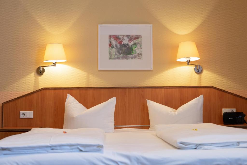 Postel nebo postele na pokoji v ubytování Hotel Europa