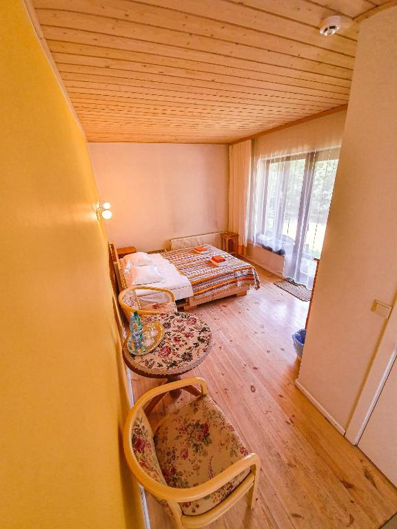 Postel nebo postele na pokoji v ubytování Mazā Kāpa