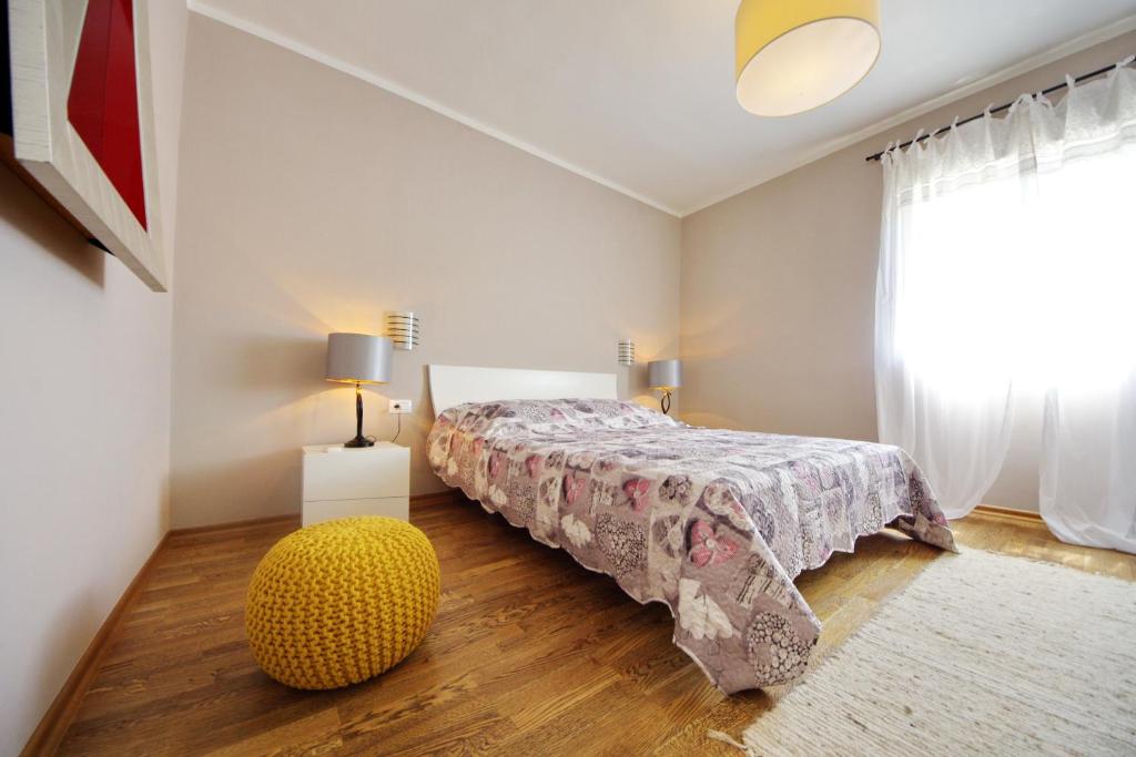 Postel nebo postele na pokoji v ubytování Apartman Marija