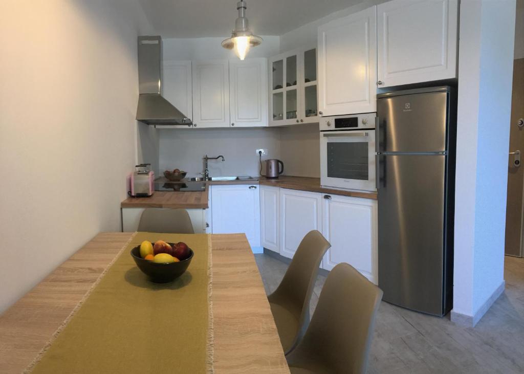 Kuchyň nebo kuchyňský kout v ubytování Holly apartman