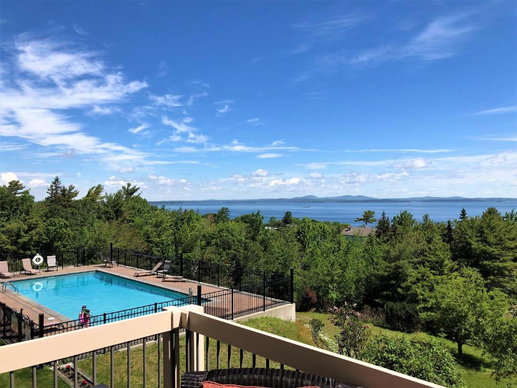 a view from a balcony overlooking a lake at Atlantic Eyrie Lodge in Bar Harbor