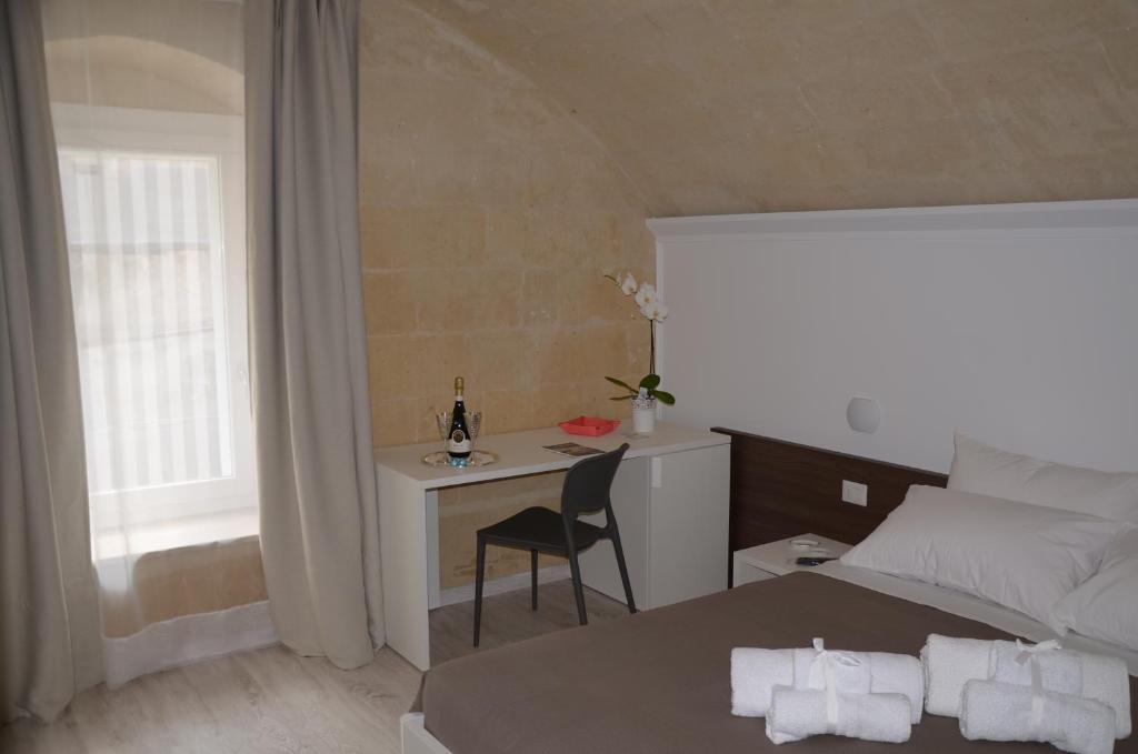 Postel nebo postele na pokoji v ubytování In & Out Matera