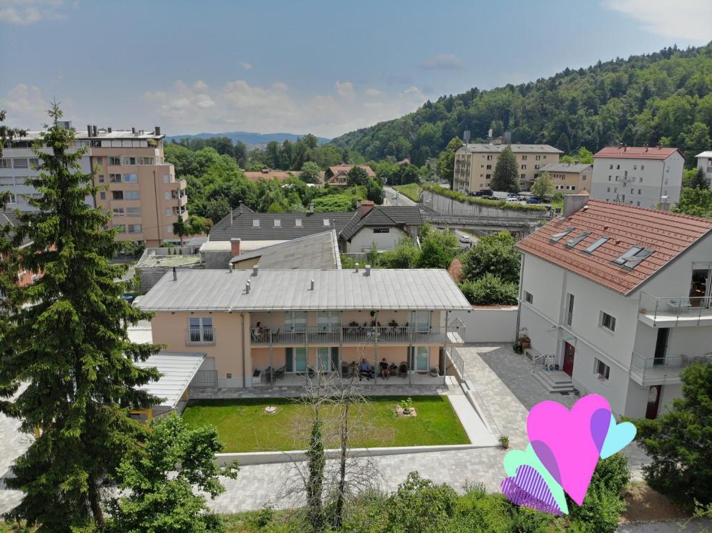 a house with a pink heart in front of it at Accommodation Baron in Ljubljana