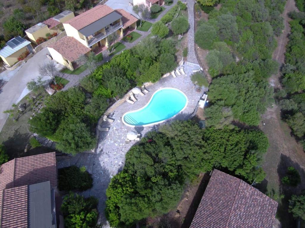 an aerial view of a resort with a swimming pool at Hotel Belvedere in Teulada