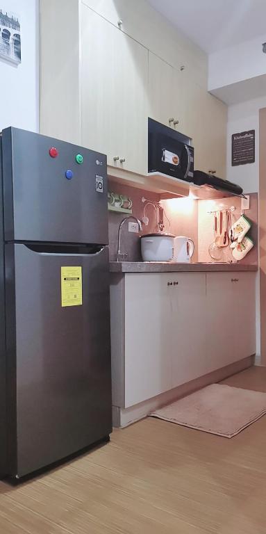 Kuchyň nebo kuchyňský kout v ubytování SMDC GRACE RESIDENCIES