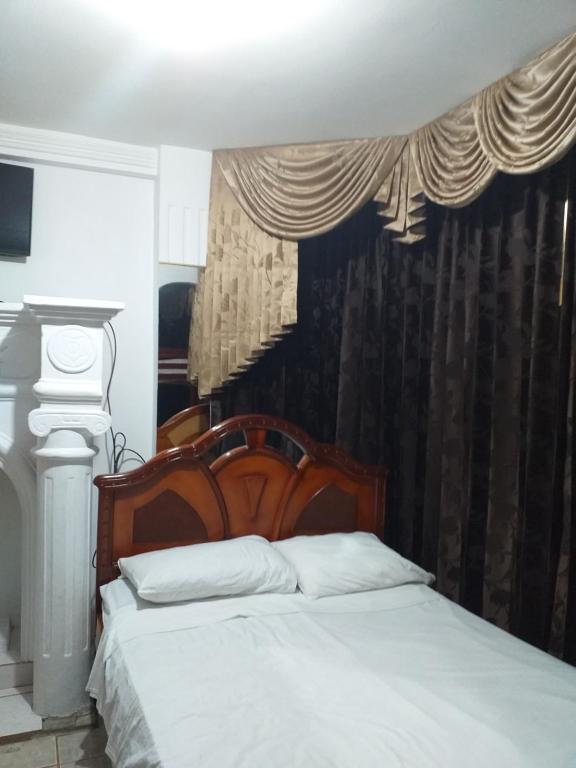 Postel nebo postele na pokoji v ubytování Hotel Rumbo al Sol