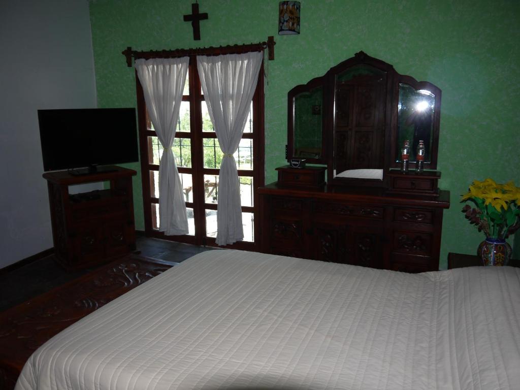 Postel nebo postele na pokoji v ubytování Hotel No Que No