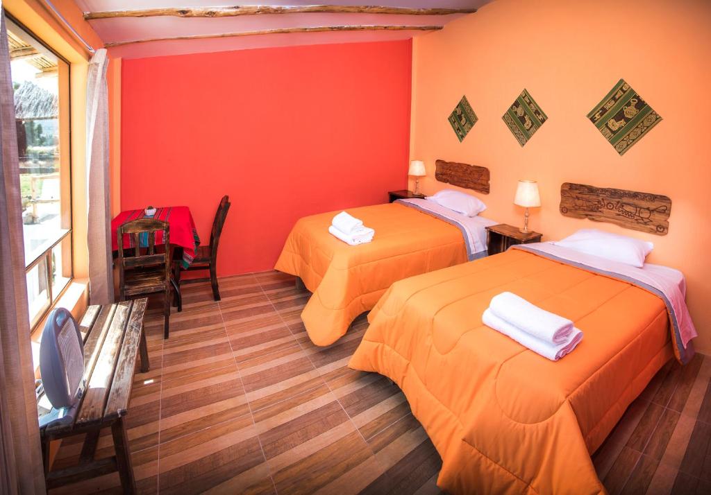 Postel nebo postele na pokoji v ubytování Le Foyer Colca