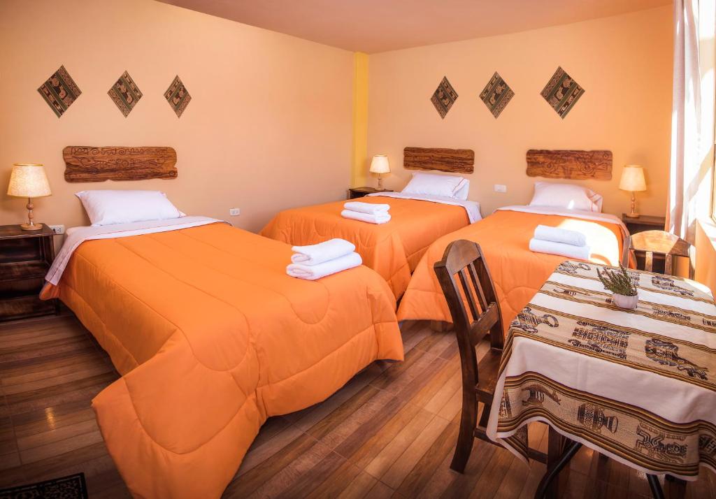 Postel nebo postele na pokoji v ubytování Le Foyer Colca