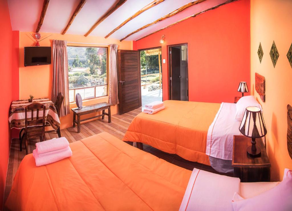 Postel nebo postele na pokoji v ubytování Le Foyer Colca