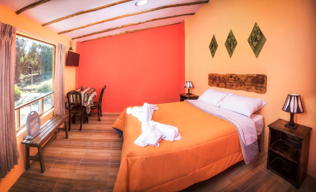 Postel nebo postele na pokoji v ubytování Le Foyer Colca