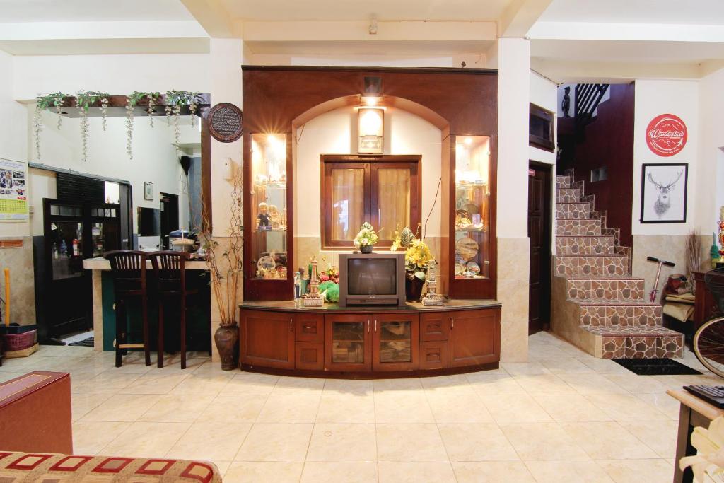 a room with a tv on a counter in a store at Wanderlust Homestay in Yogyakarta