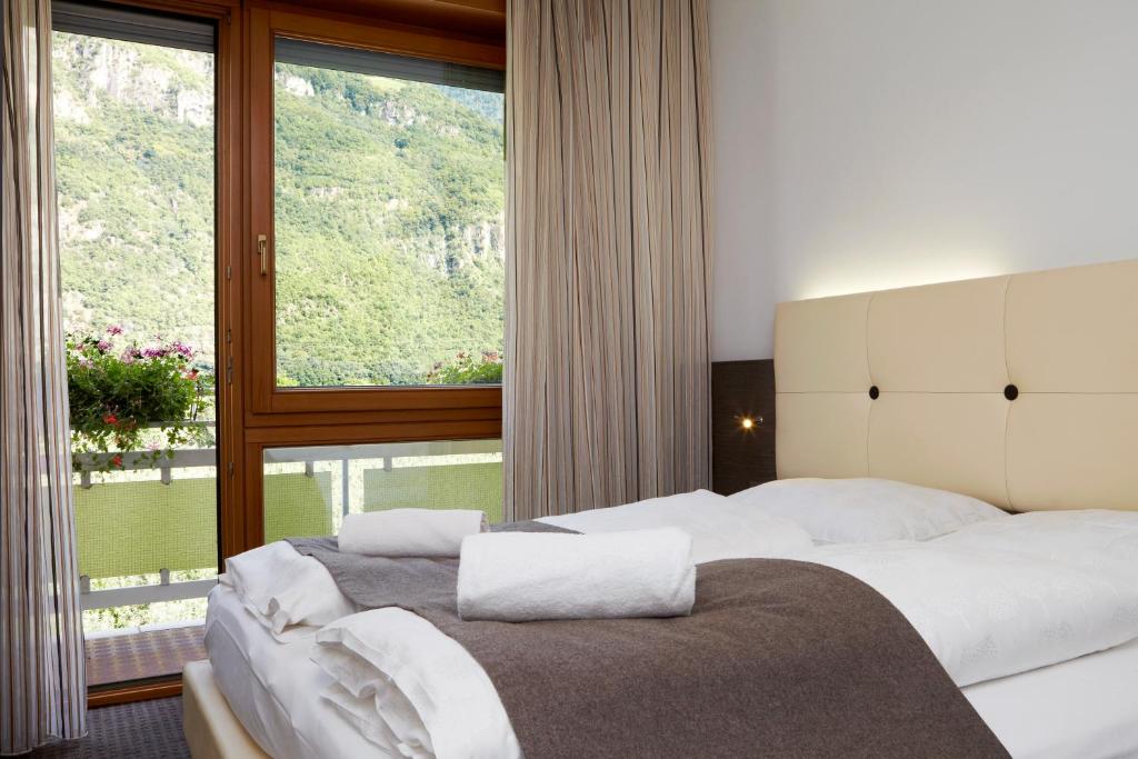 Postel nebo postele na pokoji v ubytování Hotel Raffl