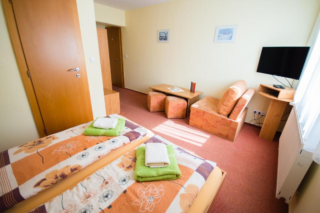 Postel nebo postele na pokoji v ubytování Penzion Ajda