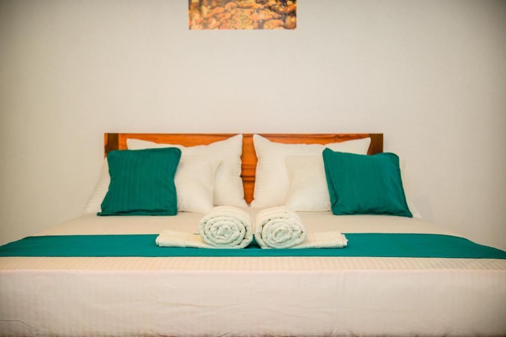 Postel nebo postele na pokoji v ubytování Kandy Spice Villa