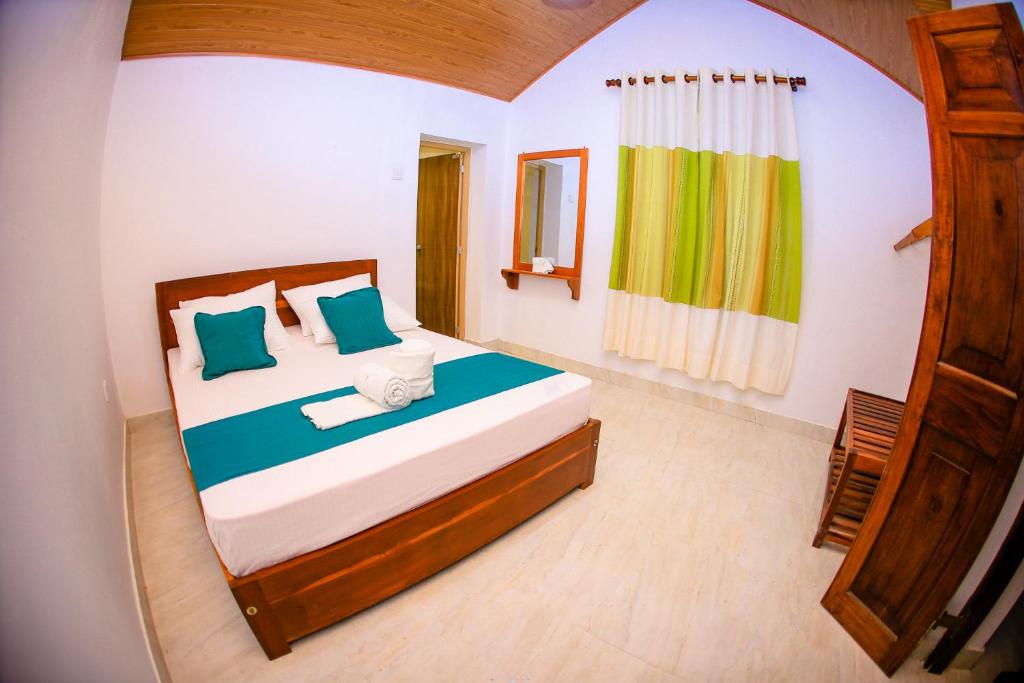 Postel nebo postele na pokoji v ubytování Kandy Spice Villa
