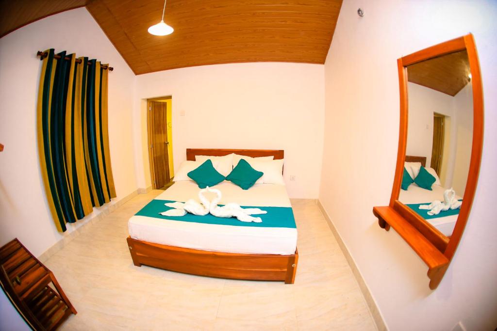 Postel nebo postele na pokoji v ubytování Kandy Spice Villa