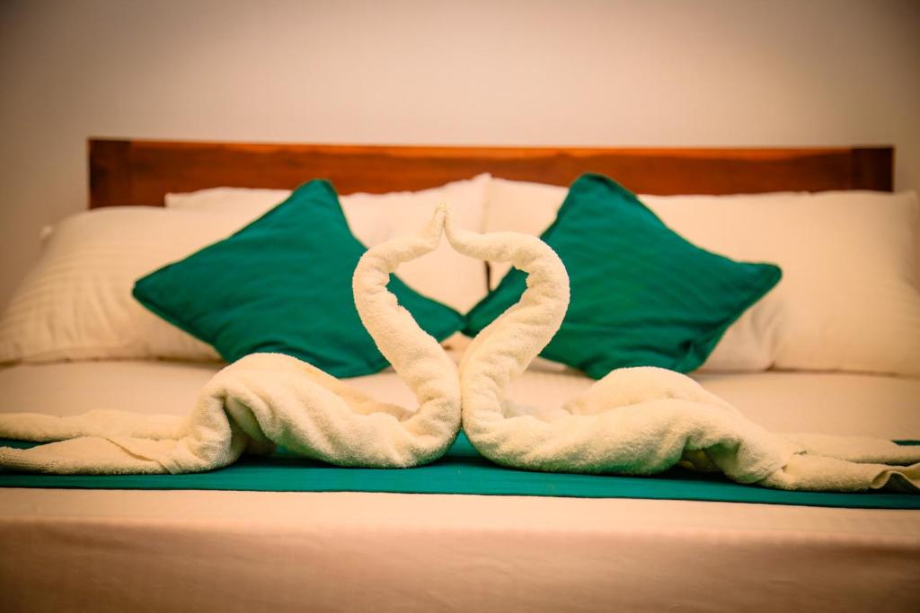 Postel nebo postele na pokoji v ubytování Kandy Spice Villa