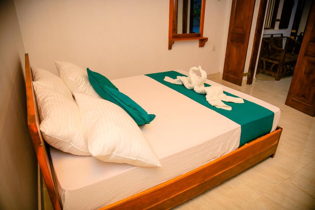 Postel nebo postele na pokoji v ubytování Kandy Spice Villa