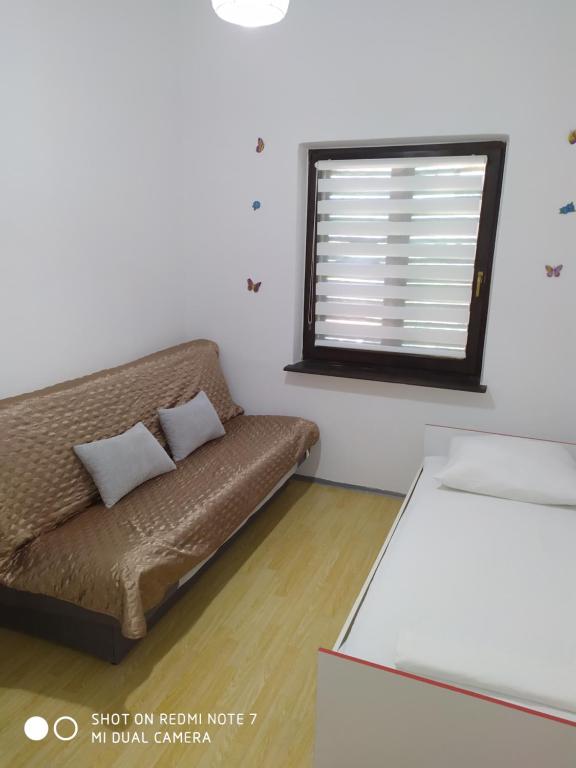 Posteľ alebo postele v izbe v ubytovaní Apartmant Sučić