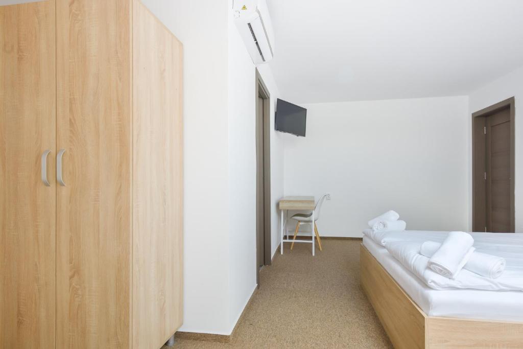 Postel nebo postele na pokoji v ubytování Pension Verona Centru