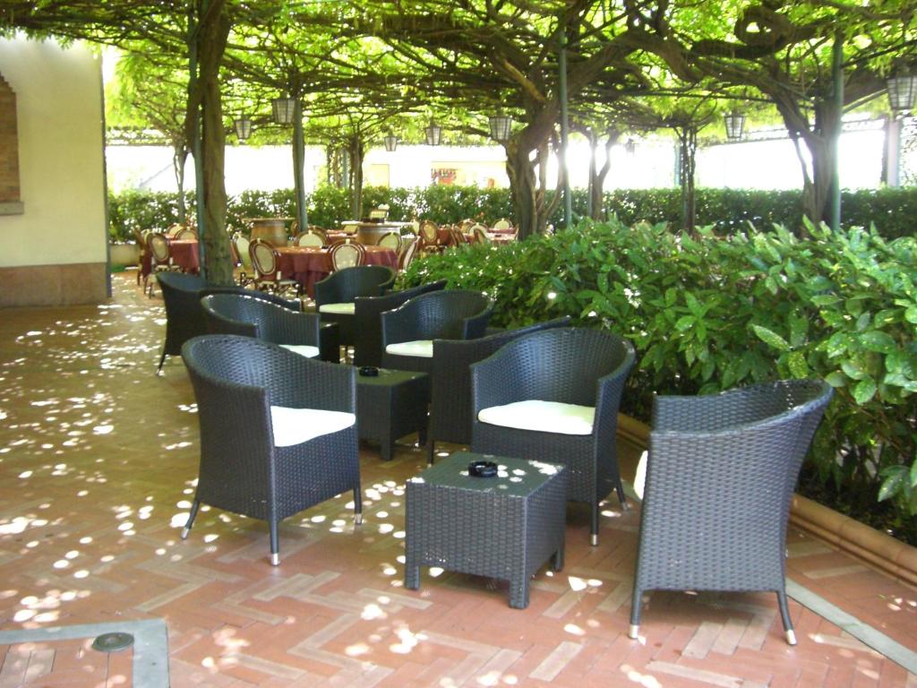 a group of chairs and tables in a restaurant at Albergo Ristorante Papa in Peschiera del Garda