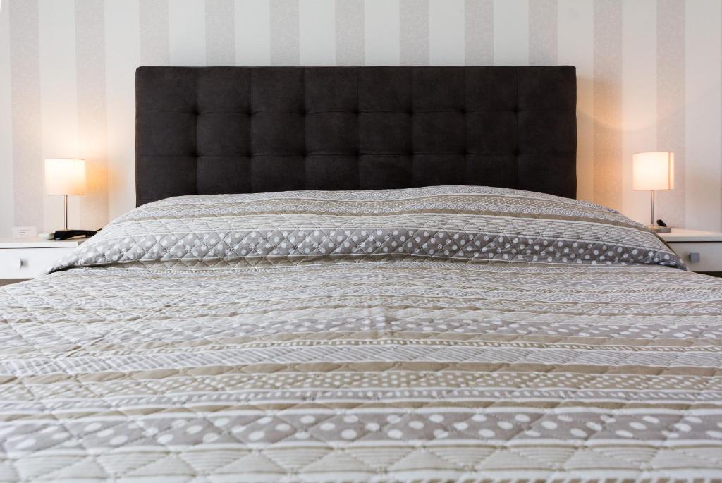 Posteľ alebo postele v izbe v ubytovaní Rooms & Apartments Bruno