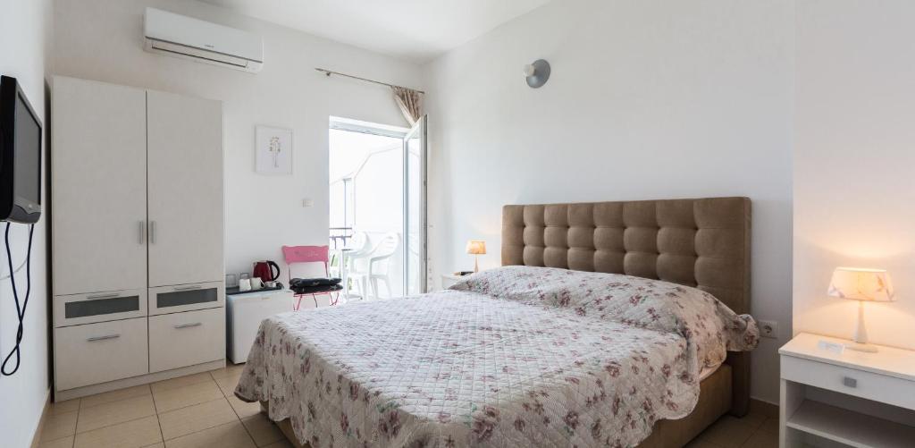 Posteľ alebo postele v izbe v ubytovaní Rooms & Apartments Bruno
