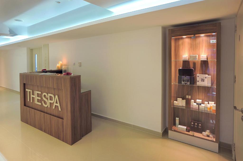a room with a spa sign on a wall at Nestor Hotel in Ayia Napa