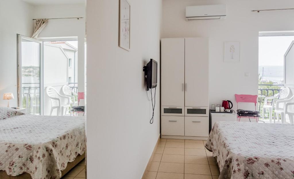 Posteľ alebo postele v izbe v ubytovaní Rooms & Apartments Bruno