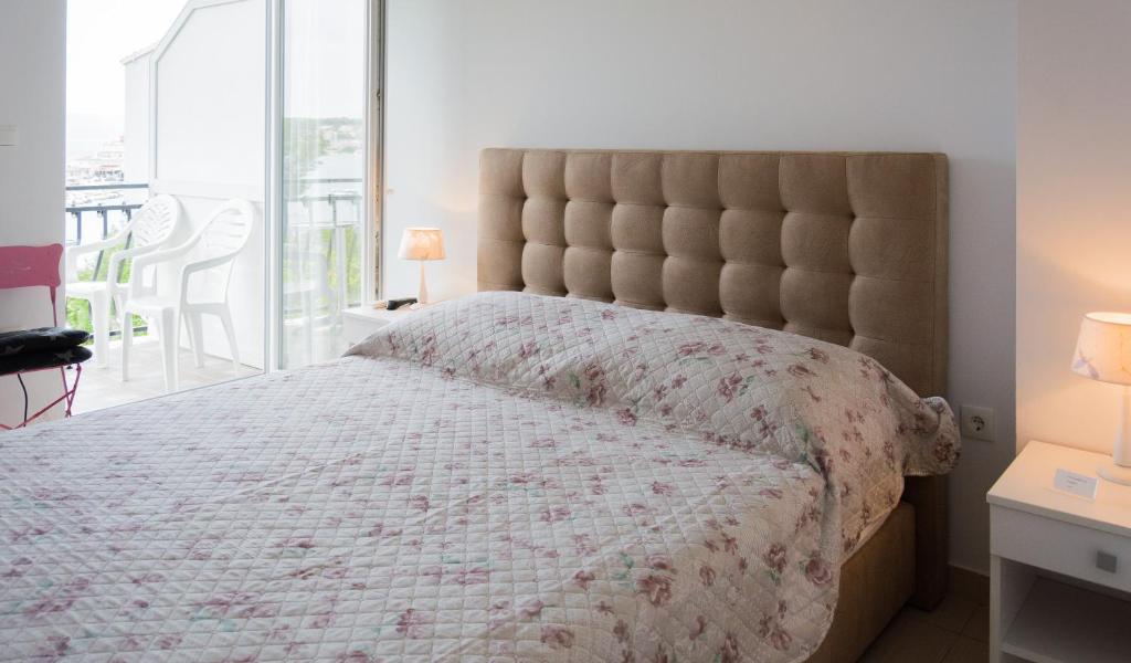 Posteľ alebo postele v izbe v ubytovaní Rooms & Apartments Bruno