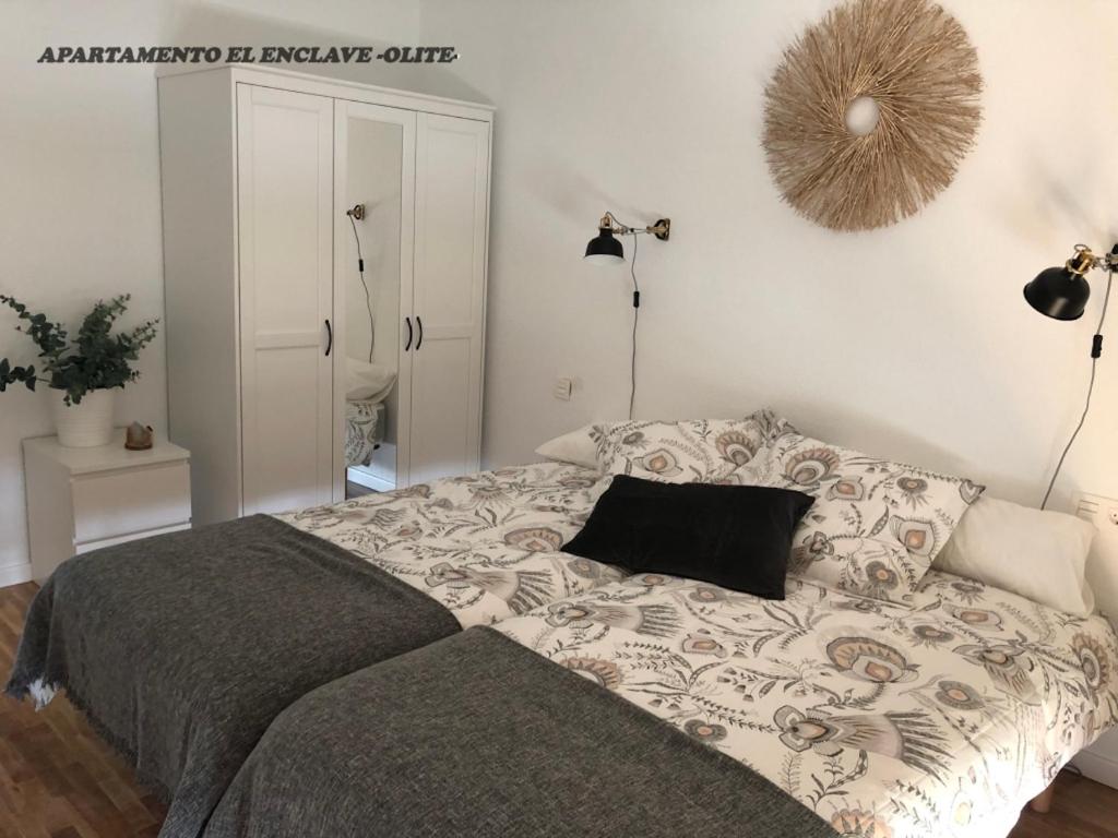 Postel nebo postele na pokoji v ubytování Apartamento Turístico El Enclave