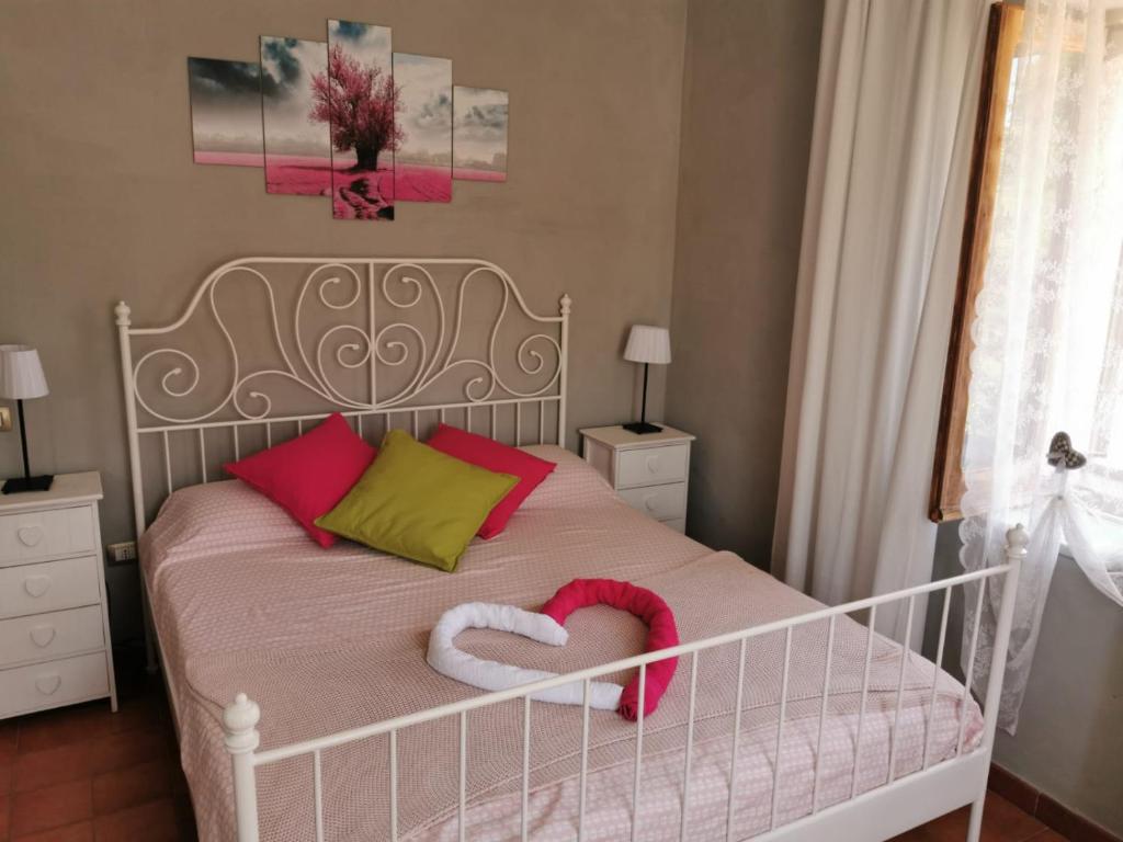 Łóżko lub łóżka w pokoju w obiekcie Al Passo di Thalia