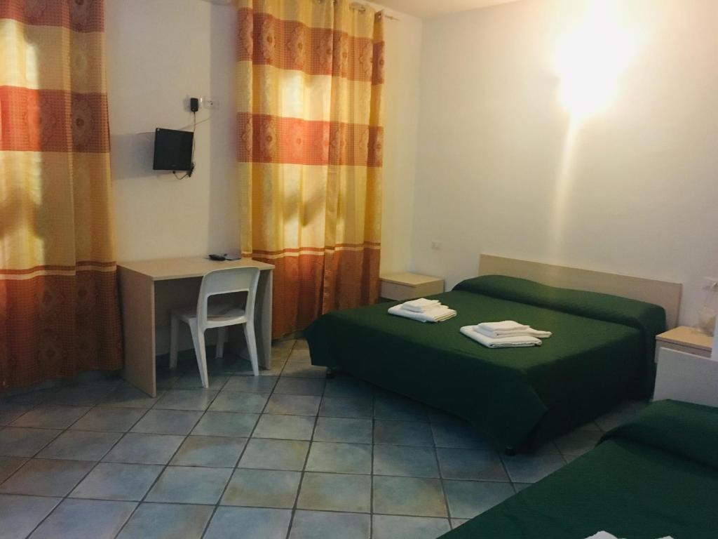 Postel nebo postele na pokoji v ubytování Albergo Villamarina
