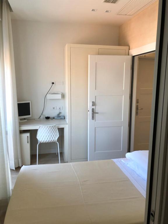 Postel nebo postele na pokoji v ubytování Hotel Bristol