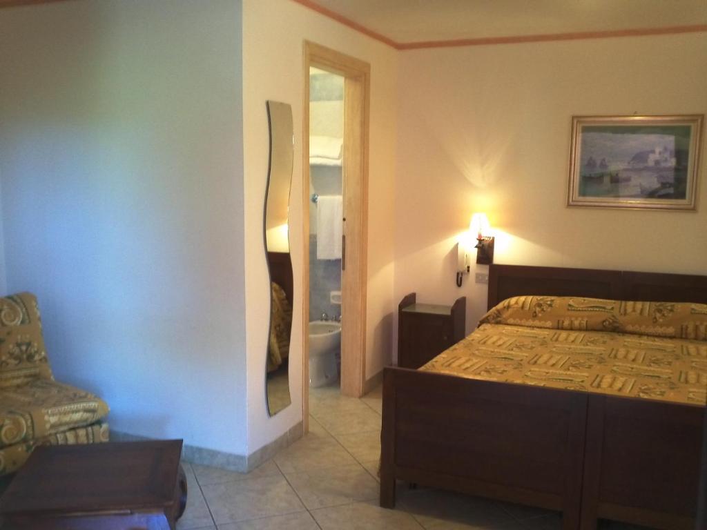 Postel nebo postele na pokoji v ubytování Hotel Abbaruja