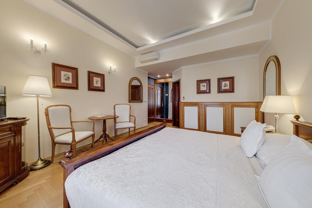 Postel nebo postele na pokoji v ubytování Louren hotel