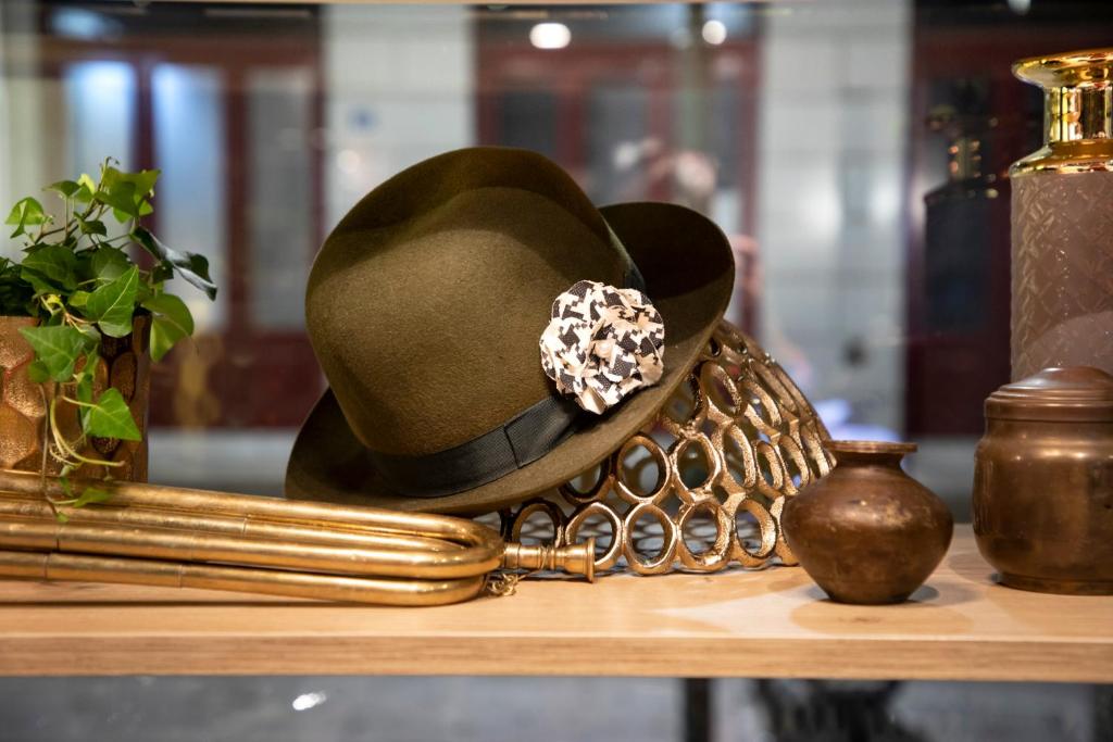 a cowboy hat sitting on a shelf at The Pinnacle Athens in Athens