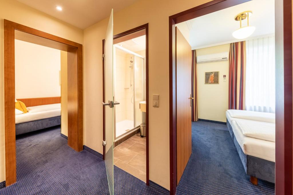 Postel nebo postele na pokoji v ubytování Austria Classic Hotel Wien