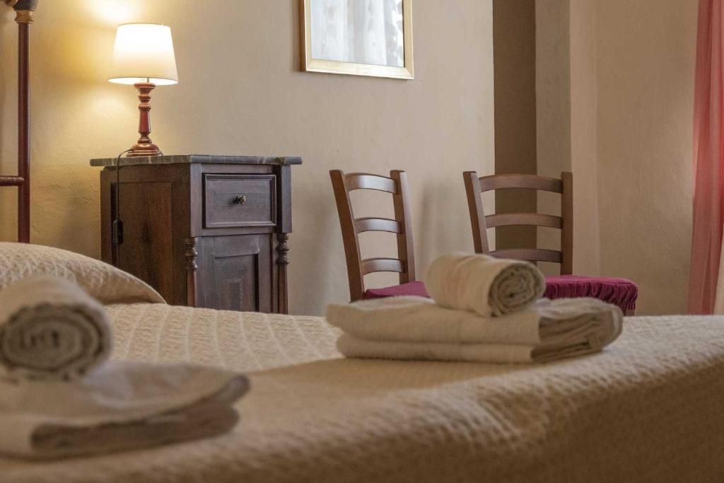 Postel nebo postele na pokoji v ubytování Agriturismo La Ripolina